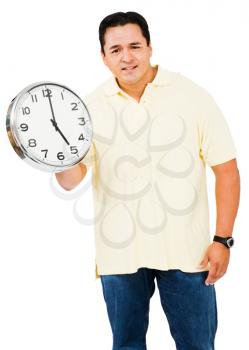 Mid adult man holding a clock isolated over white