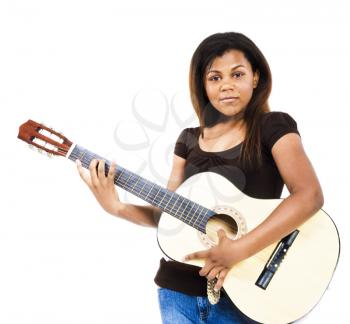 Close-up of a girl playing a guitar isolated over white