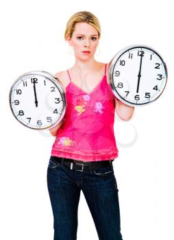 Fashion model holding clocks and posing isolated over white