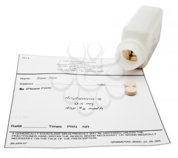 Pill bottle with a medical report isolated over white