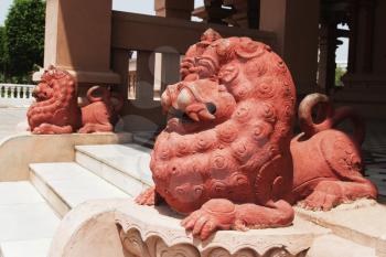 Lion statues at the entrance of a temple, Chhatarpur Temple, New Delhi, India