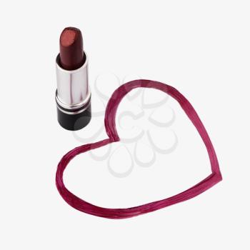Close-up of a lipstick near  heart shape drawing