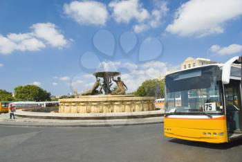 Bus in front of a fountain, Triton Fountain, Valetta, Malta