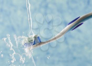 Water being poured on a toothbrush