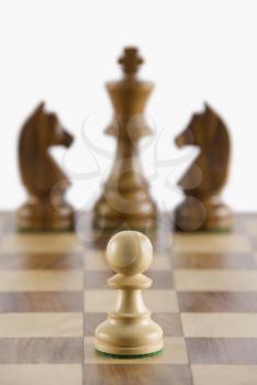 Close-up of chess pawn on a chessboard