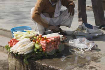 Vendor selling vegetable in a street, New Delhi, India