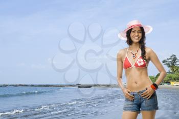 Portrait of a female fashion model posing on the beach