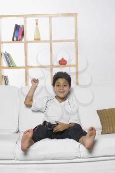 Boy playing handheld video game