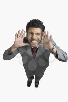 Businessman gesturing and making a funny face