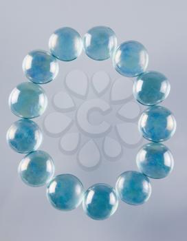 Close-up of marble balls arranged in the shape of letter O
