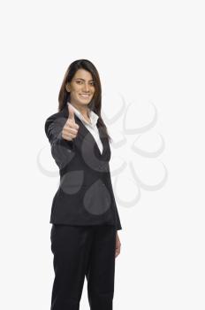 Portrait of a businesswoman gesturing thumbs up sign