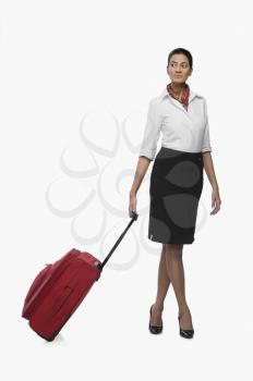Air hostess carrying her luggage