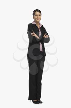 Businesswoman standing with her arms crossed and smiling