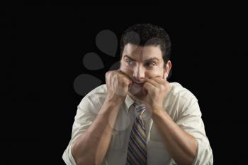 Businessman waiting with his head in hands