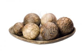 Close-up of decorative wooden balls on a tray