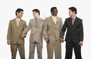 Four businessmen standing with holding hands