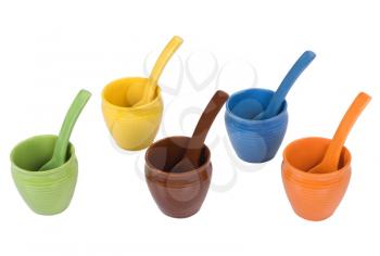 Assorted ceramic containers and soup spoons
