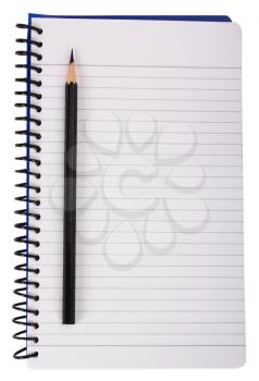 Close-up of a pencil on a spiral notebook