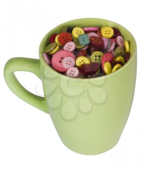 Close-up of a cup full of buttons