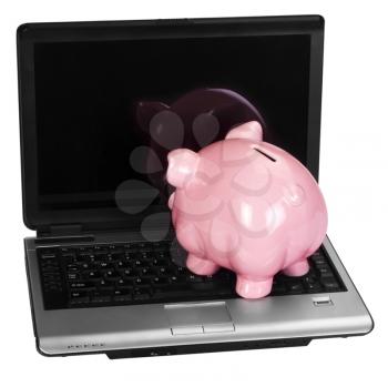 Close-up of a piggy bank on a laptop