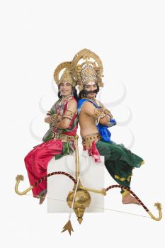 Two stage artists dressed-up as Rama and Ravana the Hindu mythological characters