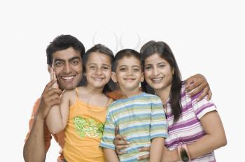 Portrait of parents with their children smiling