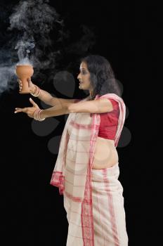 Bengali woman performing ritual dance