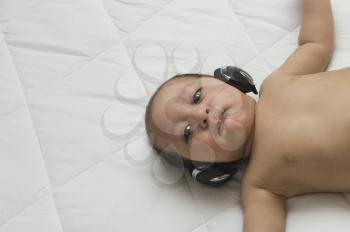 Baby boy listening to headphones