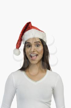 Woman wearing a Santa hat and smiling
