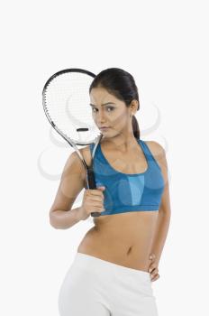 Portrait of a woman holding a tennis racket