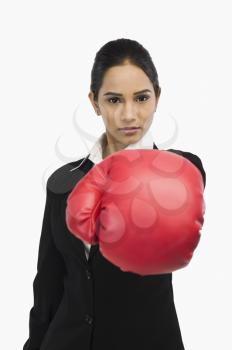 Businesswoman in boxing glove