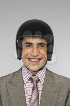 Portrait of a businessman wearing a helmet