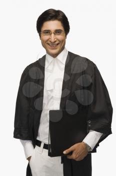 Portrait of a lawyer holding a file and smiling