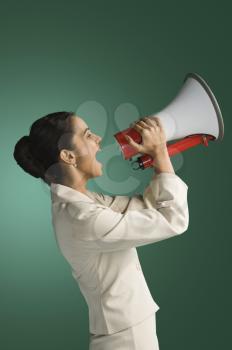 Businesswoman announcing with a megaphone