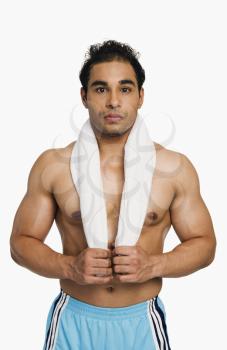 Man standing with a towel around his neck