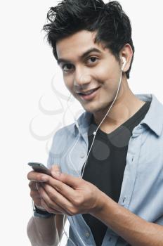 Portrait of a man listening to music on an MP3 Player