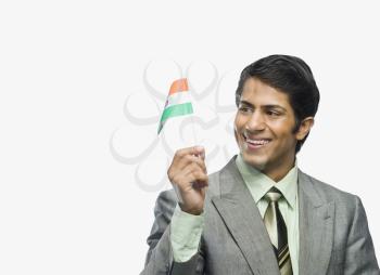 Close-up of a man holding an Indian flag