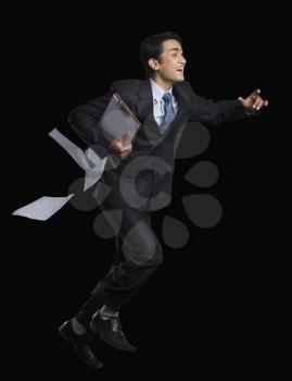 Businessman running with a clipboard