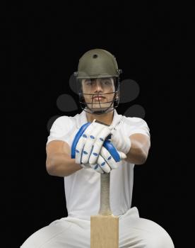 Portrait of a cricket batsman with a cricket bat