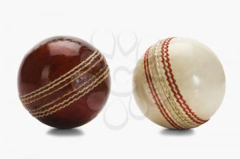Close-up of two cricket balls