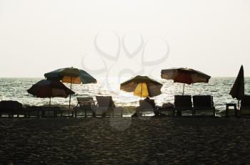 Chairs and umbrellas on the beach, Goa, India