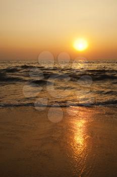 Waves on the beach at sunset, Goa, India