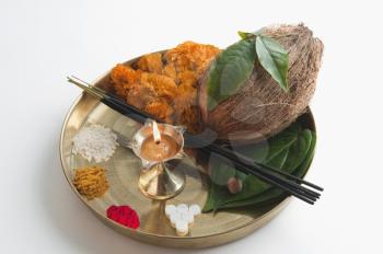 Close-up of religious offerings in a thali