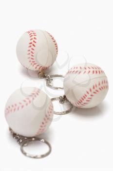 Close-up of baseball shaped key rings