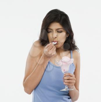 Close-up of a woman eating an ice cream