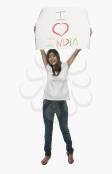 Woman holding a placard with text I Love India written on it