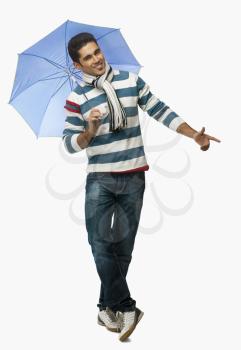 Portrait of a man holding an umbrella