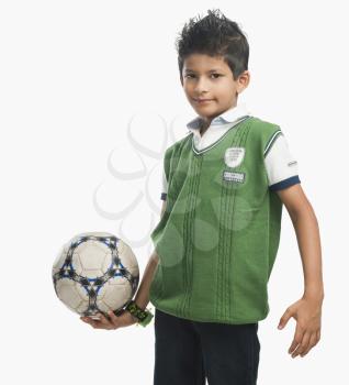 Portrait of a boy holding a soccer ball