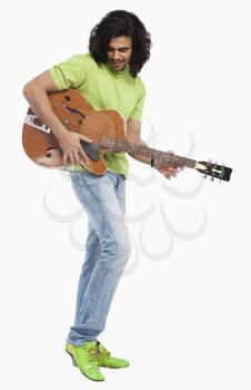 Close-up of a man playing a guitar