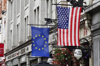 American flag and European Union flag hanging in front of a building, Republic of Ireland